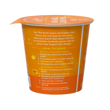 Load image into Gallery viewer, Side shot of a cup of Lotus Foods Thai Spicy Tom Yum rice ramen noodle soup, showing preparation instructions.
